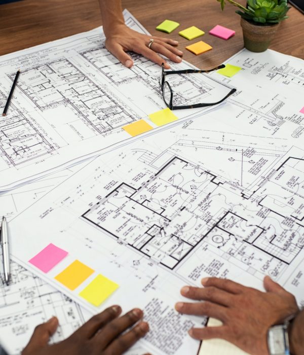 Architects working on blueprints